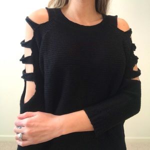 Black sweater with ripped arm detail